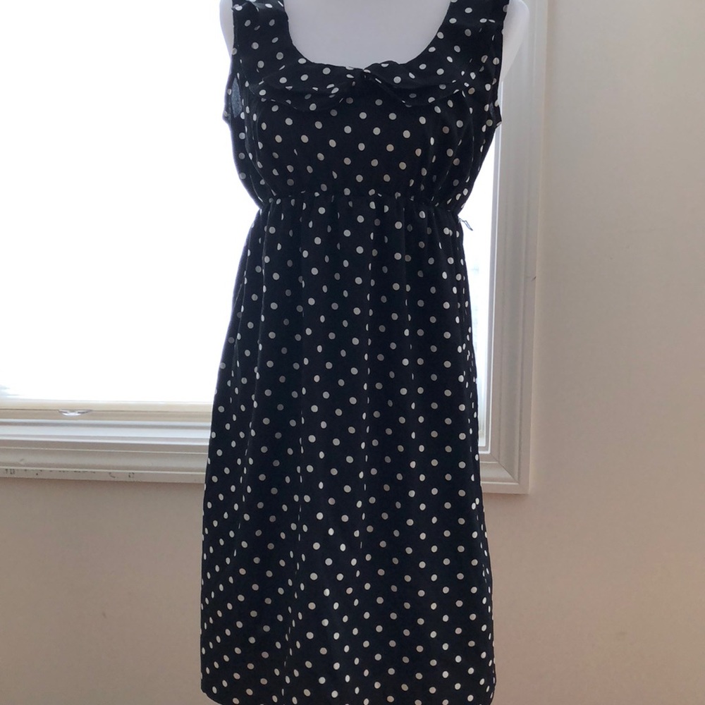 Maternity dress in black and white polka dots.